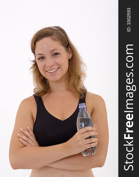 Fitness girl holding a bottle of water. Fitness girl holding a bottle of water