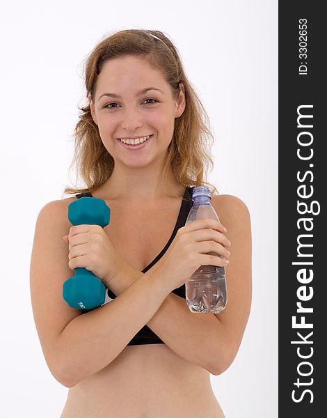 Fitness girl holding a bottle of water and a weight. Fitness girl holding a bottle of water and a weight