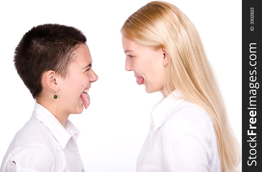 Close-cut brunette and long-haired blond stand face to face and to stick each other tongues out. Close-cut brunette and long-haired blond stand face to face and to stick each other tongues out.