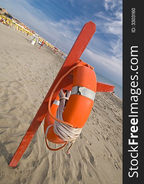 A rescue station with red life buoy. A rescue station with red life buoy