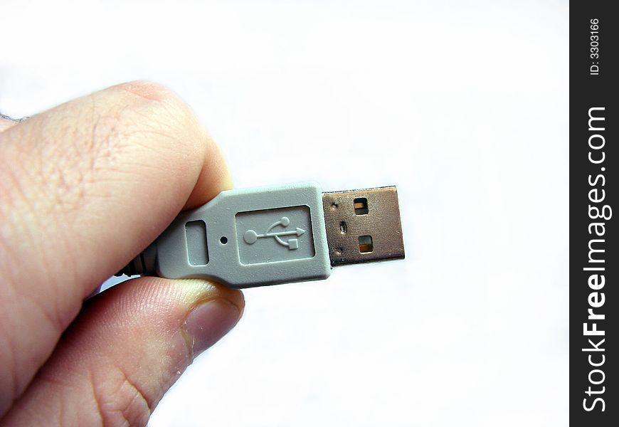 Connetion: hand and a USB cable. Connetion: hand and a USB cable