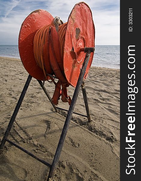 Red rescue line on a desolate beach