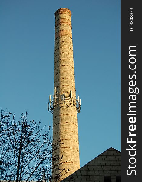 Chimney on the background of blue sky