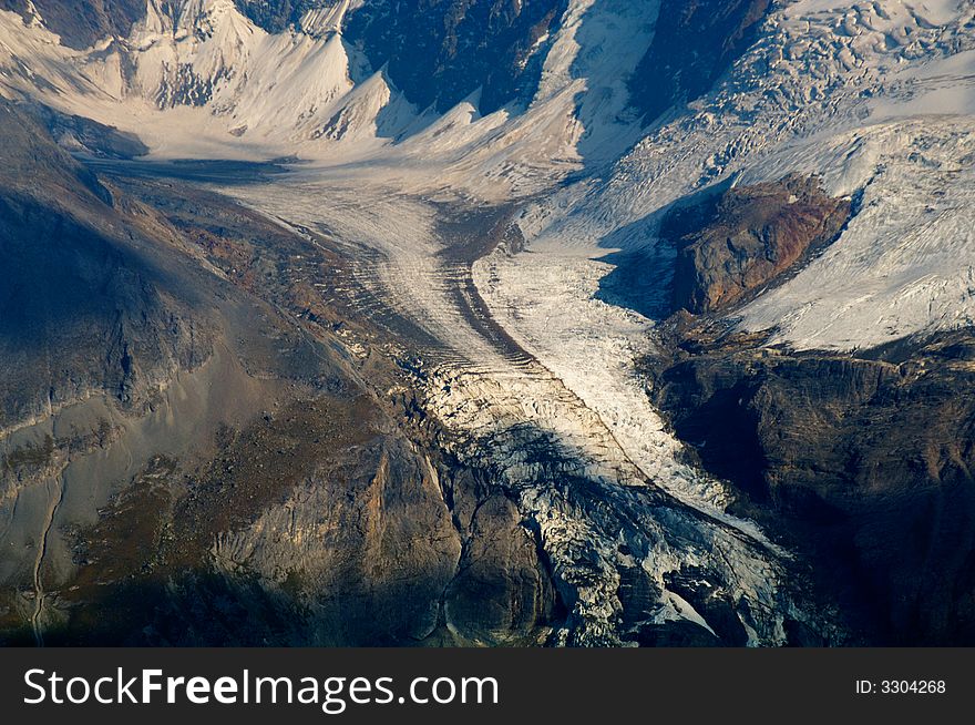 Glacier with crevasses at massif of Jungfrau in Swiss Alps. Glacier with crevasses at massif of Jungfrau in Swiss Alps.