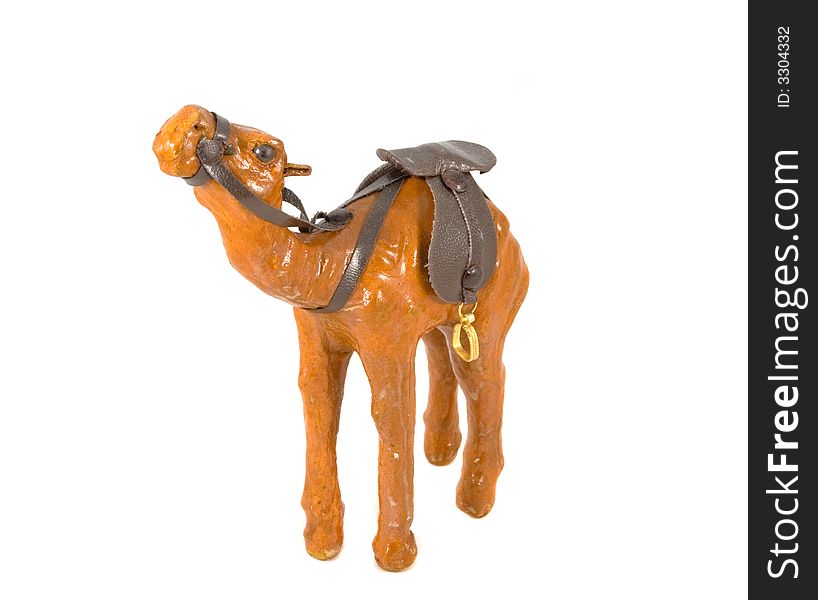 Camel toy with saddle isolated on white