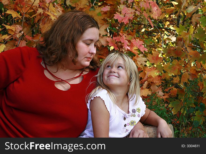 Beautiful large woman in red with her young daughter. Beautiful large woman in red with her young daughter.