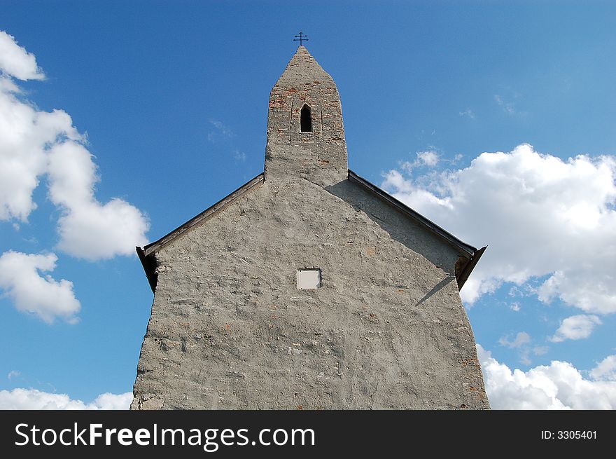 Ancient little church touching clouds in heaven. Ancient little church touching clouds in heaven