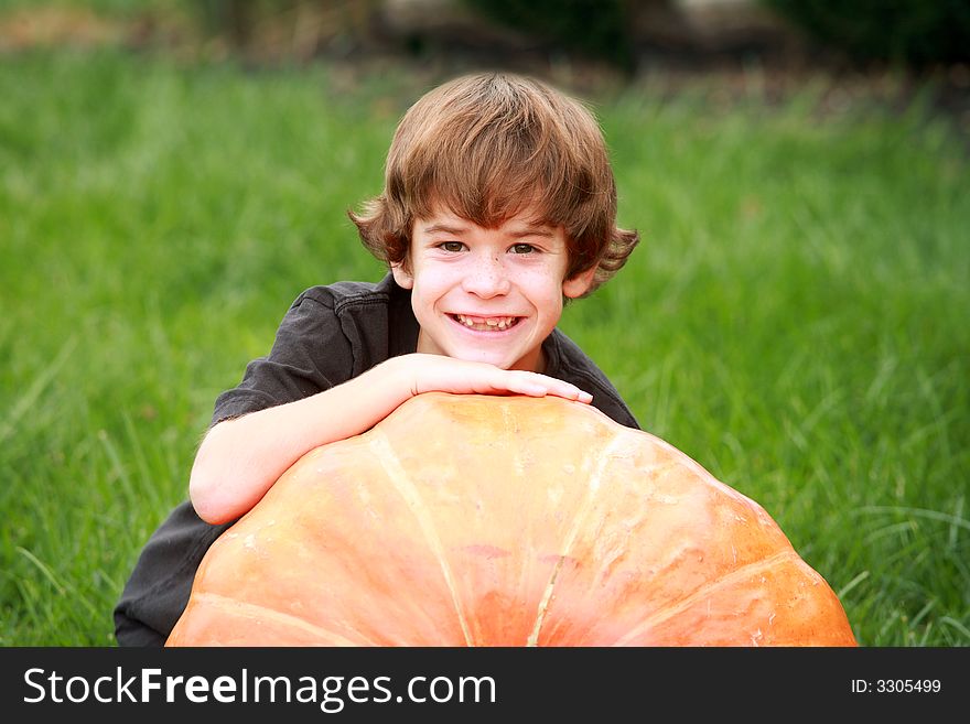 Boy and Large Pumpkin