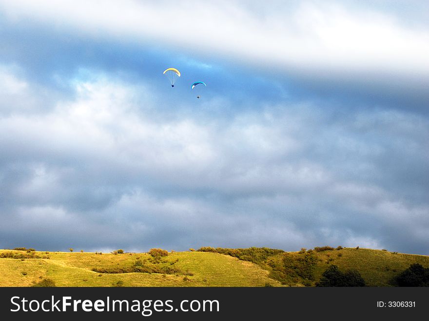 Two men are flying around