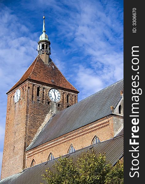 A massive gothic church, clock tower.

<a href='http://www.dreamstime.com/poland--rcollection4309-resi208938' STYLE='font-size:13px; text-decoration: blink; color:#FF0000'><b>MORE PHOTOS OF POLAND Â»</b></a>. A massive gothic church, clock tower.

<a href='http://www.dreamstime.com/poland--rcollection4309-resi208938' STYLE='font-size:13px; text-decoration: blink; color:#FF0000'><b>MORE PHOTOS OF POLAND Â»</b></a>