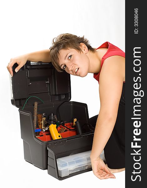 Portrait of young despondent brunette with toolbox. Portrait of young despondent brunette with toolbox