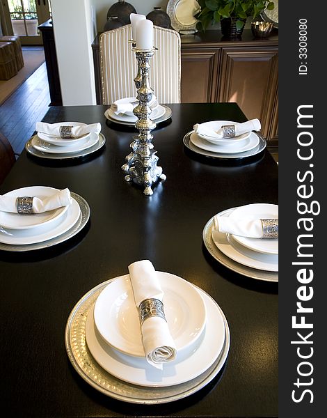 Festive dining table with luxurious dinnerware and decor. Festive dining table with luxurious dinnerware and decor.