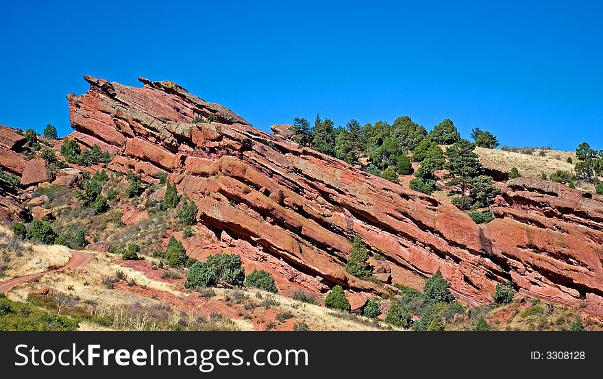 A red rocky hill