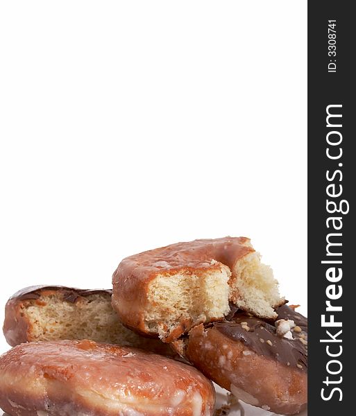 A plate of doughnuts over a white background