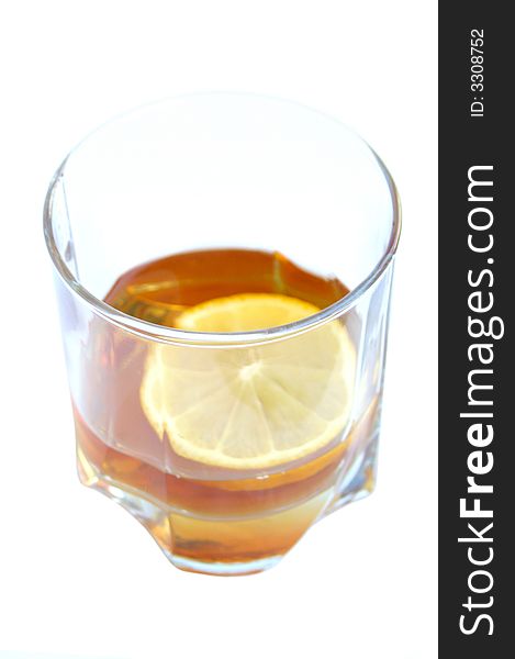 Cognac in a glass, with lemon
