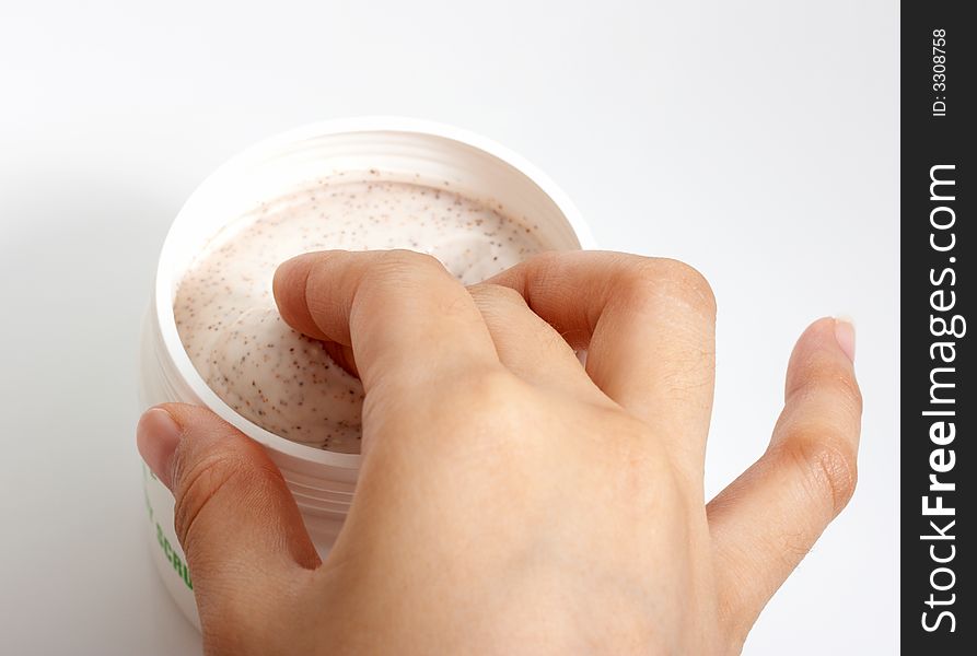 Photo of hands putting lotion over a white background