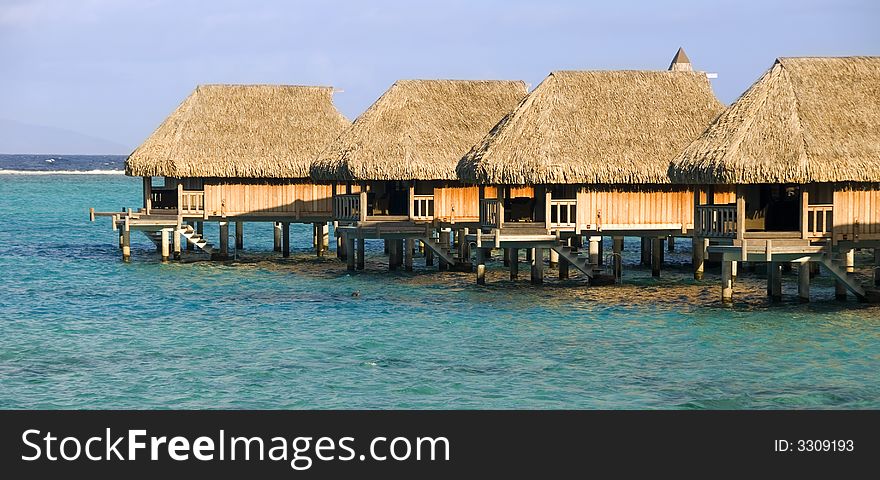 Tropical lagoon with over the water bungalow. Tropical lagoon with over the water bungalow