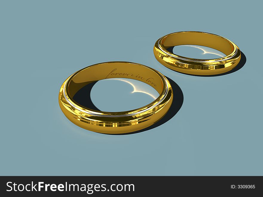 Two golden wedding rings on blue background