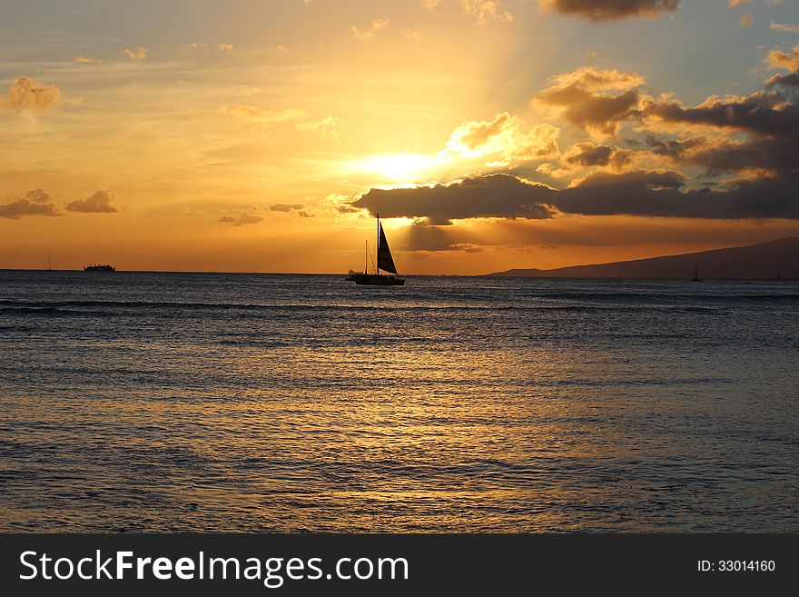 Ship in the ocean during sunset time. Ship in the ocean during sunset time