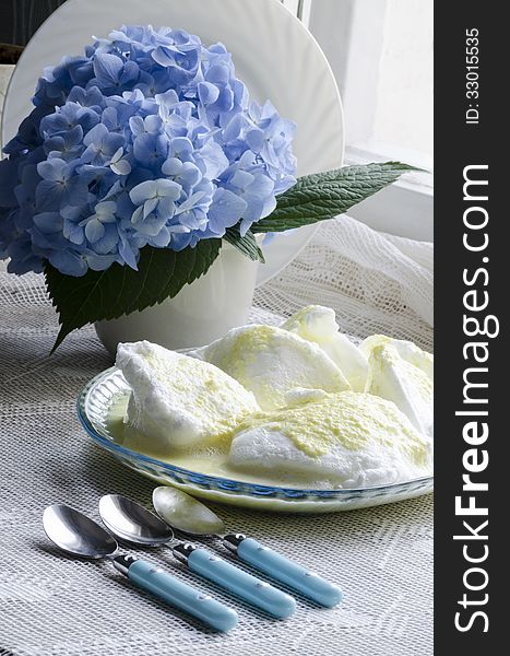 Beaten egg whites with butter cream and hydrangea