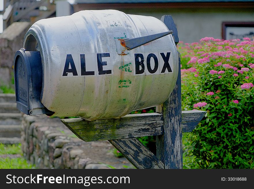 A unique and humorous mailbox made from converted beer keg, closeup. The picture was taken at Barley Creek Brewing Company, Tannersville PA. A unique and humorous mailbox made from converted beer keg, closeup. The picture was taken at Barley Creek Brewing Company, Tannersville PA.