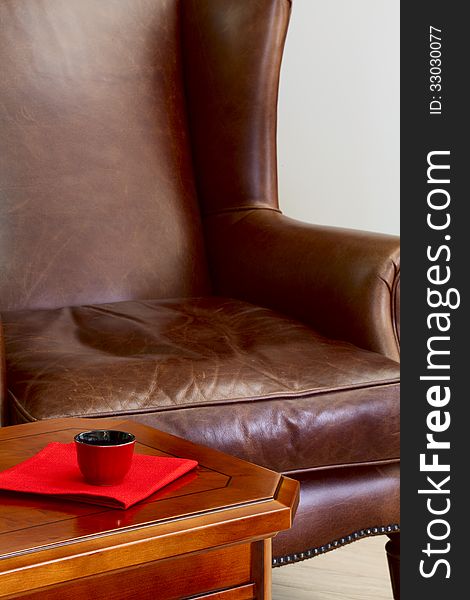 Coffee table and leather armchair