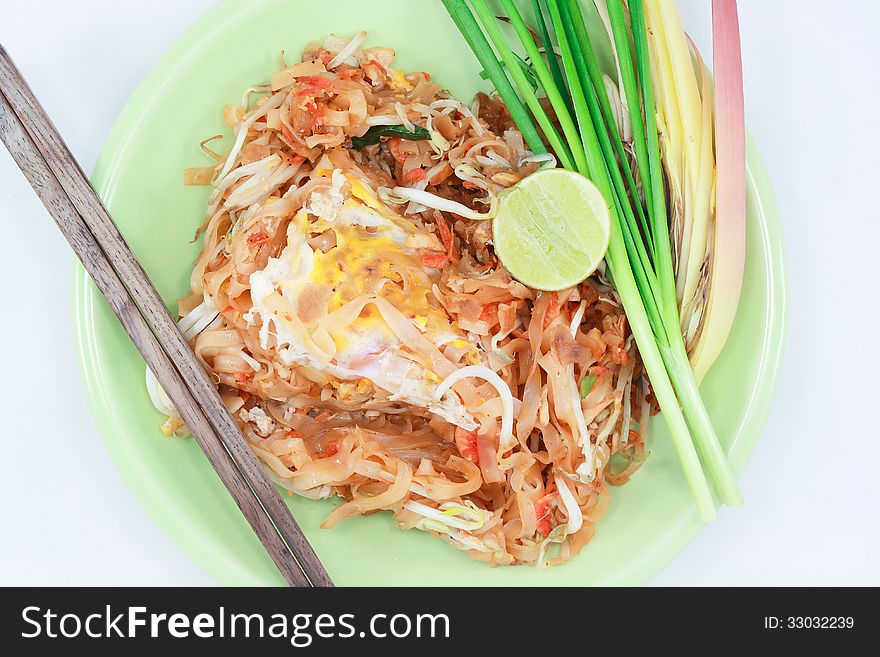 Thin rice noodles fried with tofu, vegetable, egg and peanuts (Pad Thai)