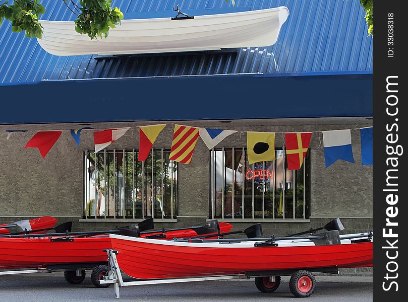 Front of the boat rental store with boat samples