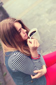 Beautiful Girl During A Rain Under Umbrella Drinks Hot Coffee Royalty Free Stock Images