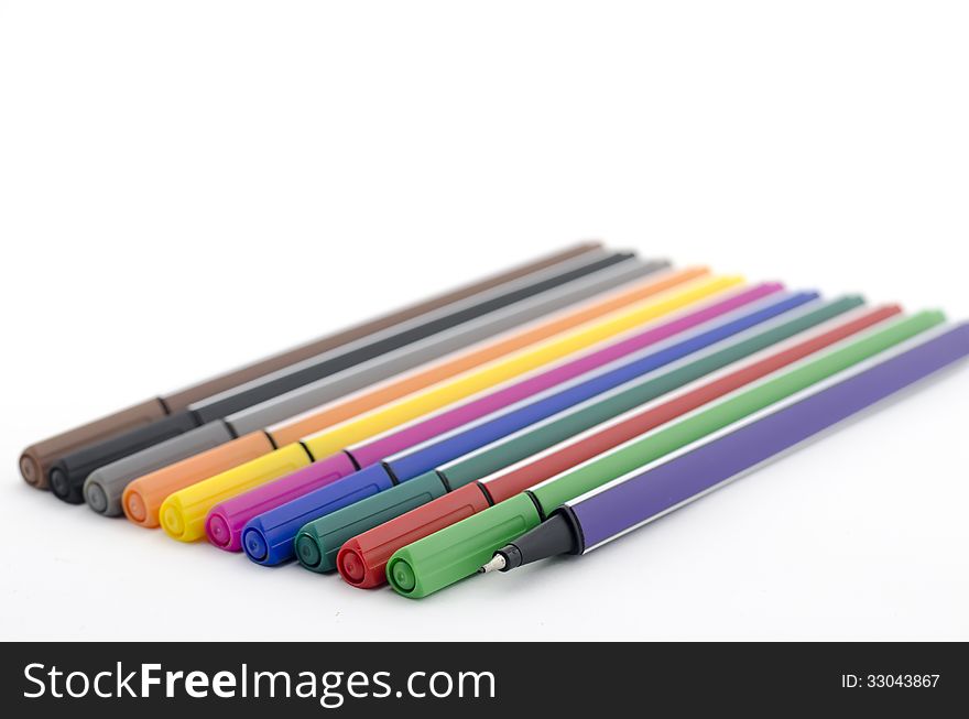 Colorful pens isolated on white background