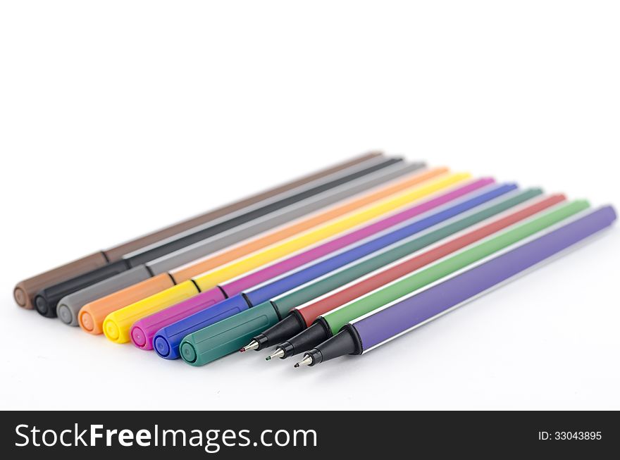 Colorful pens isolated on white background