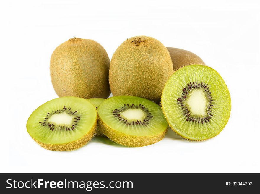 Whole kiwi fruit and his sliced segments isolated on white background. Whole kiwi fruit and his sliced segments isolated on white background