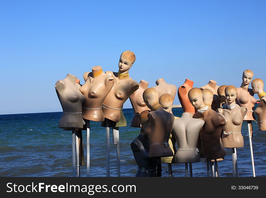 Group of dummy on beach
