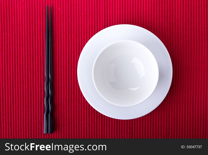 Empty bowl isolated on red background