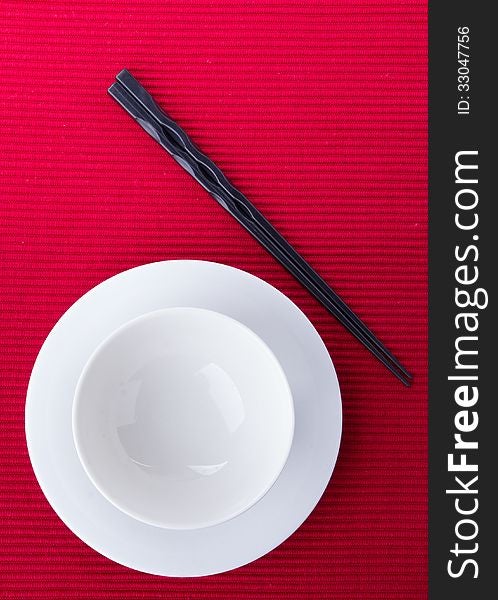 Empty bowl isolated on red background