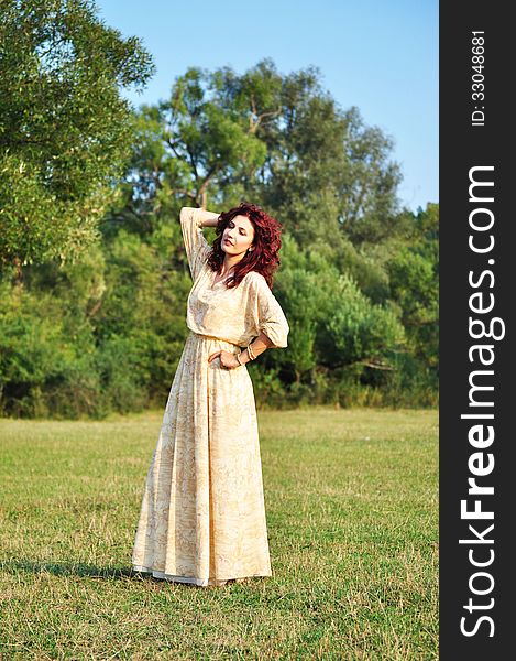 Portrait of the beautiful woman in the forest. Shooting on the nature. Portrait of the beautiful woman in the forest. Shooting on the nature.