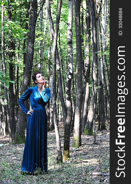 Portrait of the beautiful woman in the forest. Shooting on the nature. Portrait of the beautiful woman in the forest. Shooting on the nature.