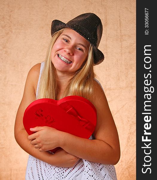 Teenage Female With Black Hat And Valentine Heart. Teenage Female With Black Hat And Valentine Heart