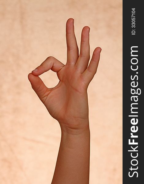 Youth hand Holding Up Okay Sign. Youth hand Holding Up Okay Sign