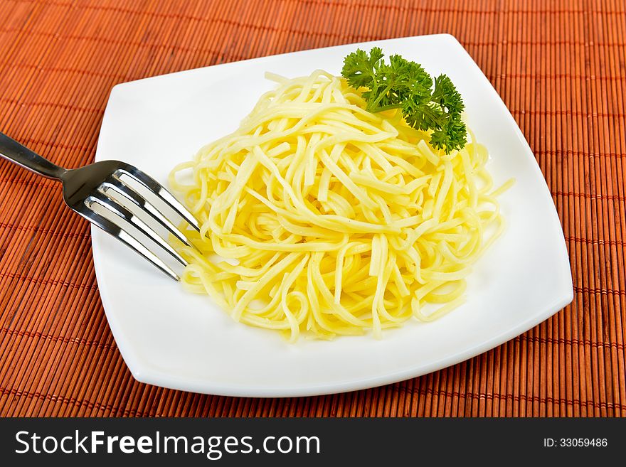 Italian egg pasta on plate with fork