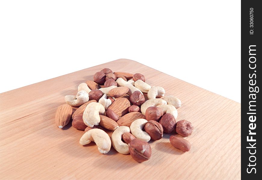 Nuts, peanuts and hazelnuts on wooden stand