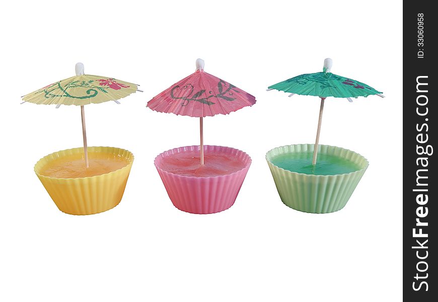 Raspberry jelly, lemon jelly, jelly kiwi, decorated with umbrellas. Raspberry jelly, lemon jelly, jelly kiwi, decorated with umbrellas