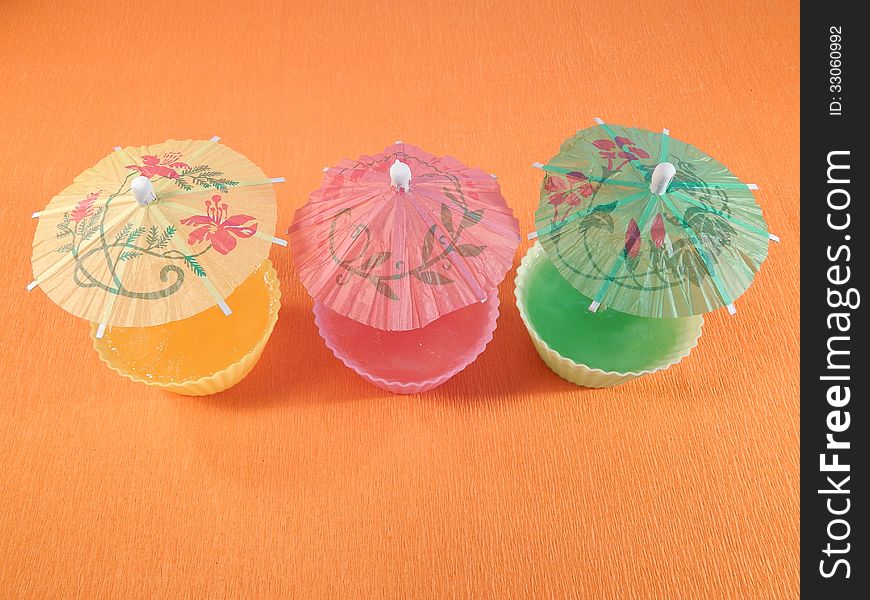 Raspberry jelly, lemon jelly, jelly kiwi, decorated with umbrellas