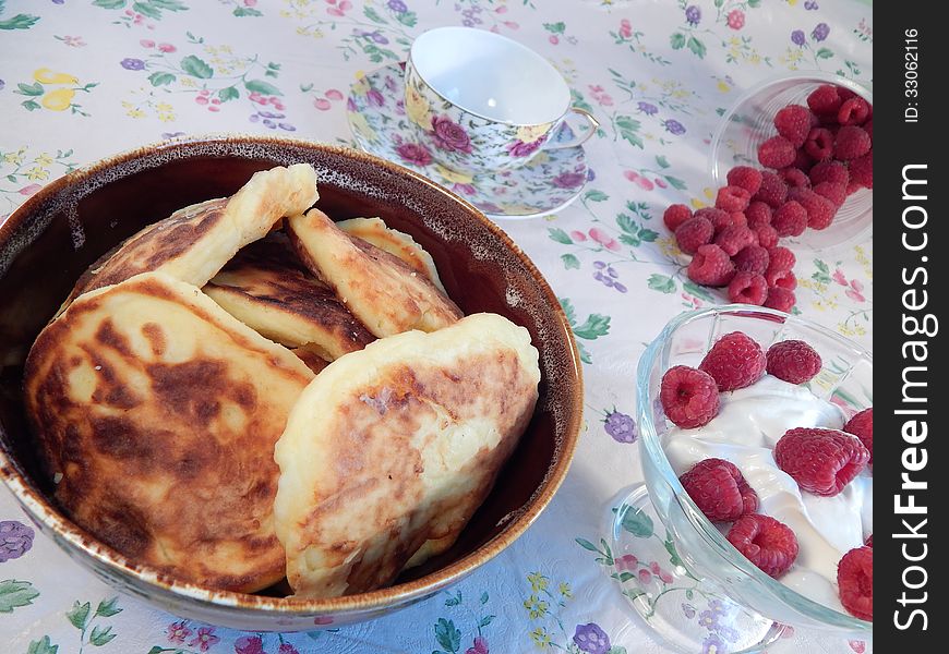 Pancakes with sour cream and raspberries, healthy breakfast