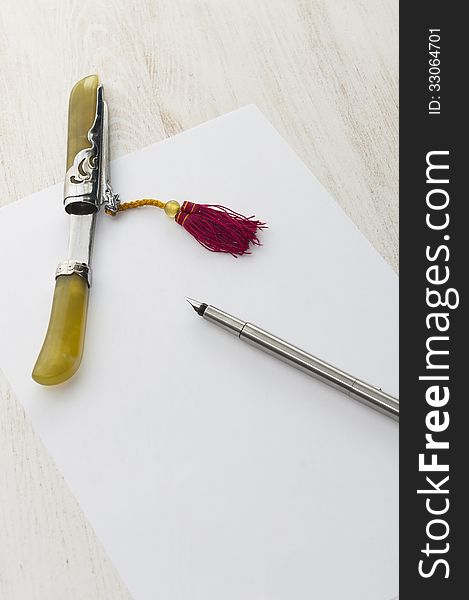 Pen and sword paper sheet
