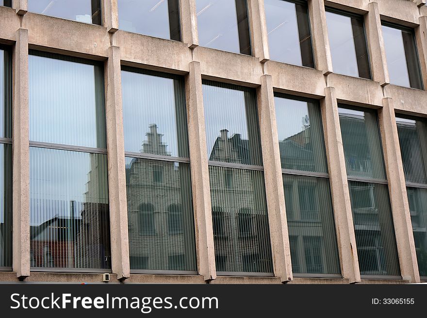 An office building with reflecting houses. An office building with reflecting houses.