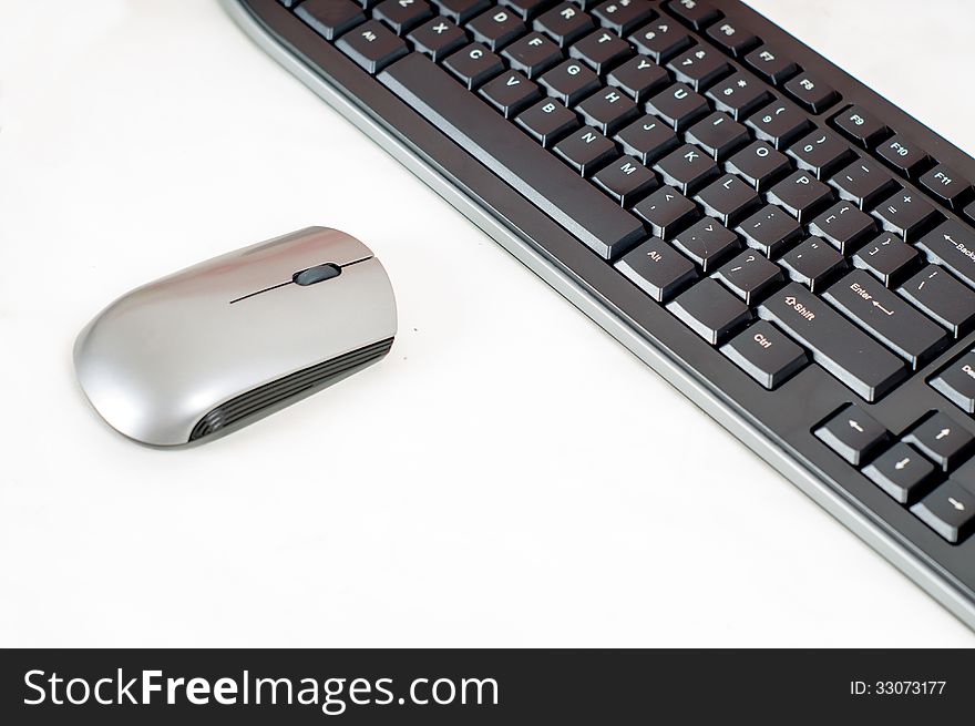 The wireless keyboard and mouse close-up connection. The wireless keyboard and mouse close-up connection.