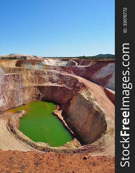 Small Open pit mine abandoned filled with water. Small Open pit mine abandoned filled with water