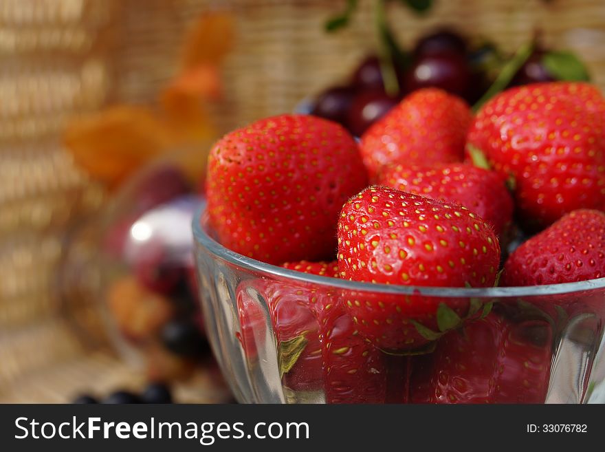 Still life of summer berries: Strawberries and Cherries.