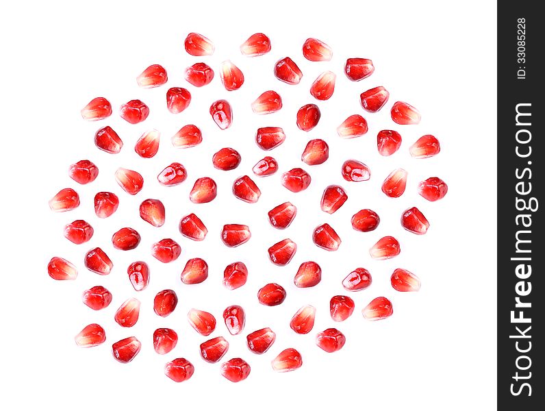 Pomegranate fruit seeds isolated on white macro background